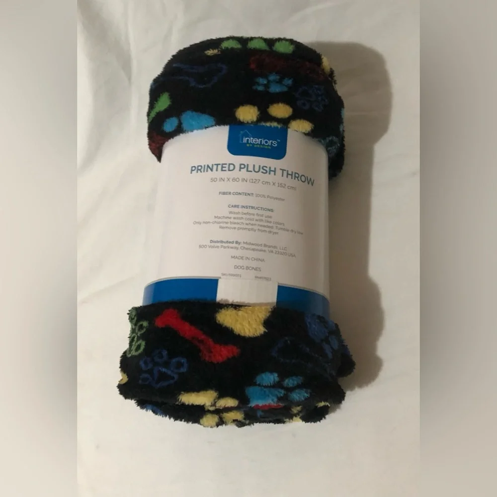 Black Plush Blanket Roll with Multicolor dog bones and Paw Print Pattern. 50X60